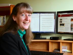 Secretary at a desk with a computer